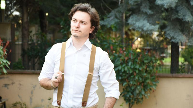brown suspenders and denim